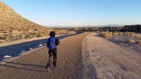 40-Kenny_running_on_trail_around_Lone_Mountain_for_last_temp_reading_for_science_experiment
