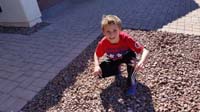 11-picking_weeds_out_of_the_rocks_at_Grammy_and_Grandpa_Duke's_house