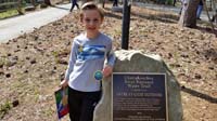 22-Kenny_shows_off_his_badge_and_patch_he_earned