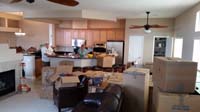 02-Grandpa_Duke_and_Grammy_in_their_house-moving_truck_has_dropped_everything_off