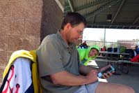 11-Daddy_playing_with_Mommy's_smartphone_using_an_app_to_synch-control_his_new_camera