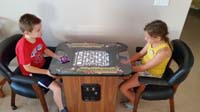 50-generational_flashback_and_oddity-Kenny_and_Zoe_playing_Pac-Man