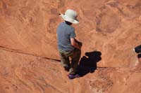 36-Kenny_stuffs_his_pant_pockets_full_of_rocks