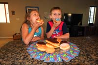 10-Zoe_and_Kenny_show_off_their_donuts