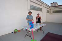 07-Daddy_volunteering_at_the_milk_jug_toss