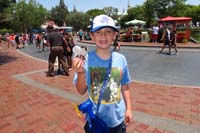 042-Kenny_is_so_happy_to_cool_down_with_sprayer_he_bought_and_a_frozen_treat