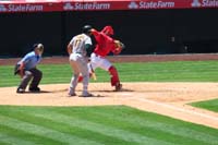 087-Angels_catcher_throws_ball_so_hard_and_moves_so_fast_his_helmet_comes_off_by_itself1