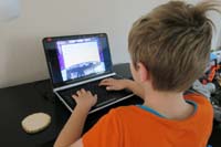 42-Kenny_practicing_typing_on_his_laptop-needed_to_improve_skills_for_school