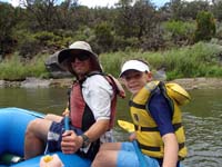 11-Daddy_and_Kenny_on_raft-ready_to_paddle_per_guide_instructions