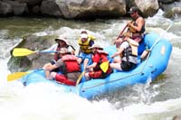 30-family_traveling_through_rapid-Kenny_giggling_so_much,but_not_paddling-purchased_from_Southern_Exposure