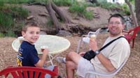 44-enjoying_our_ice_cream-little_stream_behind_buildings