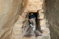 077-Kenny_climbing_through_a_narrow_passageway-note_all_the_oil_stains_from_people's_hands