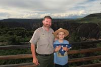 004-Gets_royal_treatment_from_Ranger_Mike_for_Jr_Ranger_oath_ceremony.Very_Happy_Kenny_wears_the_hat_well