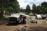015-looking_back_at_campsite_and_campground-Mommy_and_Faye_relax_in_shade