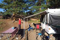 118-fun_activity_for_Kenny_putting_pine_cones_on_the_roof_of_the_camper-still_using_that_dump_truck