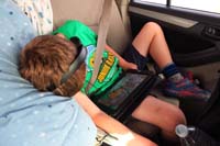 086-late_afternoon_and_lots_of_driving-Kenny_is_pooped-movie_on_tablet_still_running