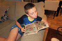 52-Kenny_is_now_officially_becoming_a_geek-he_wanted_to_read_some_of_Daddy's_old_comic_books_about_Teen_Titans
