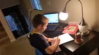 10-Kenny_doing_his_homework_at_his_desk_in_the_family_room