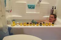 67-Kenny_takes_a_bath_with_all_his_duckies_watching