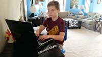 72-Kenny_working_hard_typing_on_his_laptop