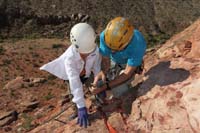 05-Ed_hooking_Kenny_to_descending_rope-he_is_secured_as_backup_with_that_carabiner_and_webbing-can't_fall