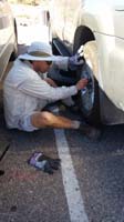 51-Daddy_changing_the_flat_tire