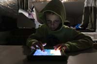 20-Kenny_really_likes_playing_with_his_Kindle