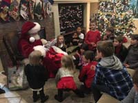 047-Aiden's_annual_Christmas_party-waiting_for_Santa_to_present_Kenny's_gift
