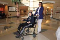 074-Kenny_gets_to_be_wheelchaired_out_of_the_hospital_to_the_car