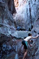 28-Kenny_carefully_climbing_out-slippery-John,Dhiraj,Suman_waiting_for_us-we_spent_hour_in_water