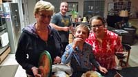 24-1030pm-Grammy,Kenny,Savannah,Tommy-getting_cookies_ready_for_Santa
