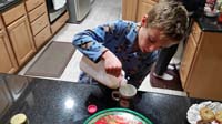 25-Kenny_getting_cookies_and_milk_ready_for_Santa
