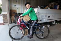 02-Kenny_and_his_new_adult_sized_bike-Daddy_bought_used_from_friend_for_$25