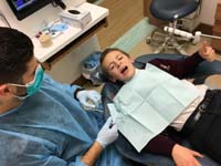 21-thumbs_up_getting_a_sealant_placed_on_permanent_molars_at_new_dentist_by_house