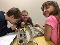 22-Kenny,Ella,Chaeli_having_fun_with_vinegar_acid_test_at_Rock_Hound_practice