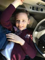 27-Kenny_likes_to_sit_in_Daddy's_lap_waiting_in_car_line_to_be_dropped_off_for_school