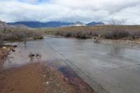 30-Pine_Creek_water_flowing_across_scenic_drive_road-Daddy_walked_to_the_gauge_station