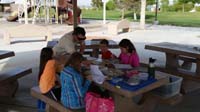 10-Daddy_coaching_Science_Olympiad_Rock_Hound_team_at_park_since_nearby_school_closed