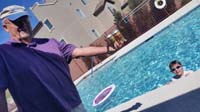 12-Grandpa_Duke_shows_off_his_beers_while_Kenny_swims_in_community_pool