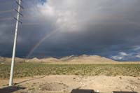 14-storm_clouds_and_rainbow_behind_our_house_in_the_morning