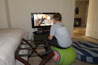 20-Kenny_really_enjoys_playing_video_games_sitting_on_the_ball