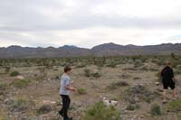 22-family_taking_Brinkley_for_a_walk_in_desert_behind_our_house