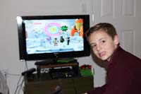 40-Kenny_playing_Lego_video_game_on_Xbox-testing_new_lens_for_SLR