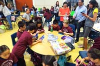 02-kids_playing_electronics_together_waiting_for_the_events_to_start