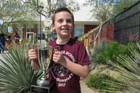 25-Kenny_holds_the_trophy_for_the_A_team-still_neat_for_his_school_to_win