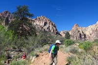 02-Kenny_and_Lexi_with_the_canyon_we_are_entering_in_the_distance-after_checking_out_some_water