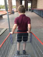 02-riding_the_cart_into_Costco_with_Daddy