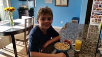 11-Kenny's_typical_breakfast-bowl_of_Cherrios,fruit,glass_of_orange_juice