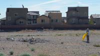 64-our_house_to_left,Daddy_picking_up_trash_by_the_wall-Kenny_enjoyed_the_work