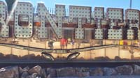 064-Mommy_and_Kenny_in_the_Frontier_sign_selfie